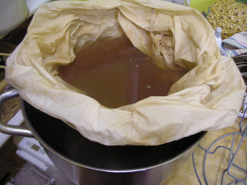 Filtering the juice in a muslin sack
