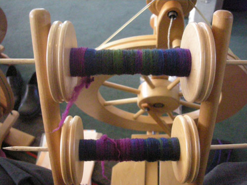 Two bobbins spun from the same end