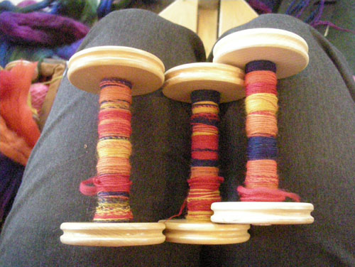 Three bobbins of marled singles