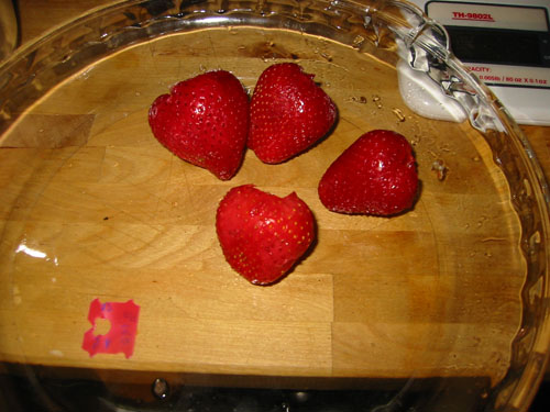 Mashing strawberries for juice